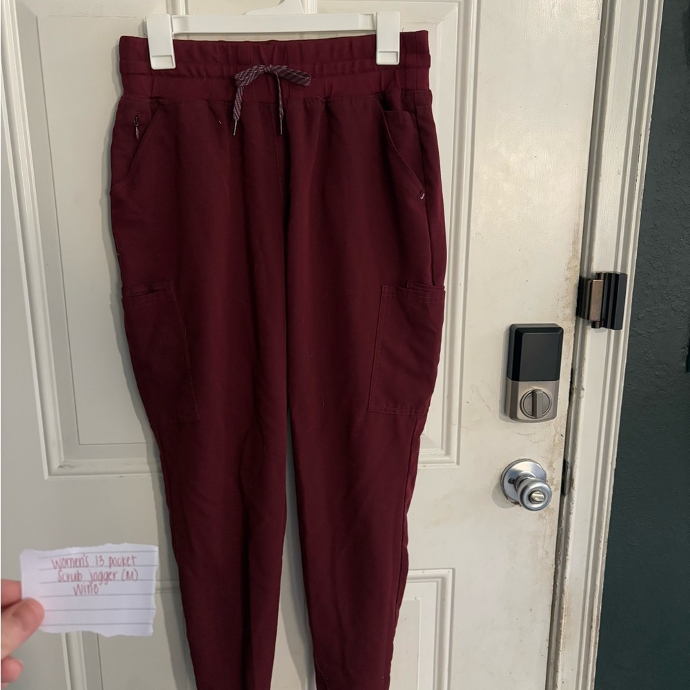 Jaanuu women’s 13 pocket jogger scrub pants in wine